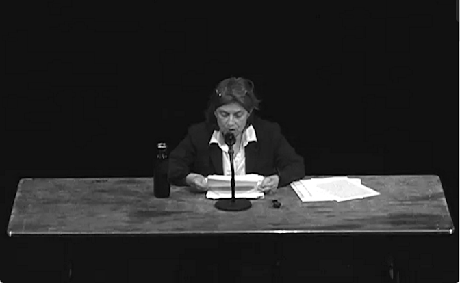 Still from video documentation of Chantal Akerman reading “My Mother Laughs “ at The Kitchen, 2013 as part of the exhibition "Chantal Akerman: Maniac Shadows"